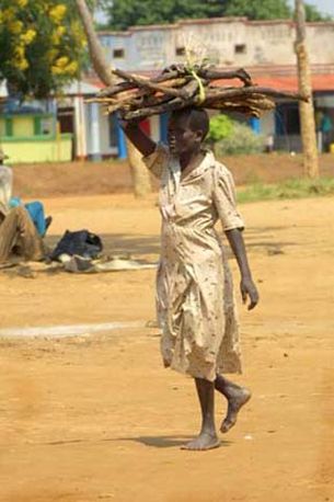 Woman carrying wood, Moyo, Northern Uganda