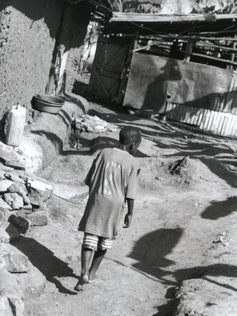 Walking home, Eden Slum, Kampala, Uganda