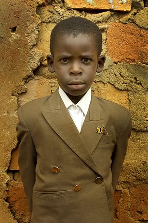 Boy in a smart jacket, Eden Slum, Kampala, Uganda